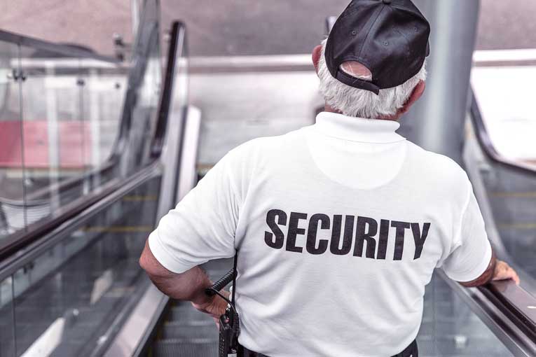 2-ISJ- What is Corporate Security? Security Guard Riding Escalator